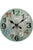 Grünliche Wanduhr mit AMS-Ziffern und Zeigern