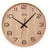 Wanduhr mit hellem Holzgehäuse, schwarzen Ziffern und Zeigern sowie AMS-Schriftzug