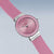 Damenuhr schräg mit rosafarbenem Armband und rundem roséfarbenem Zifferblatt