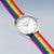 Bering Uhr mit silbernem Gehäuse, weißem Zifferblatt und buntem Regenbogen-Textilband