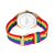Armbanduhr mit Rückseite im goldfarbenen Gehäuse und Regenbogen-Stoffarmband