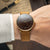 Sternglas Herrenuhr mit braunem Lederarmband und dunkelbraunem Zifferblatt