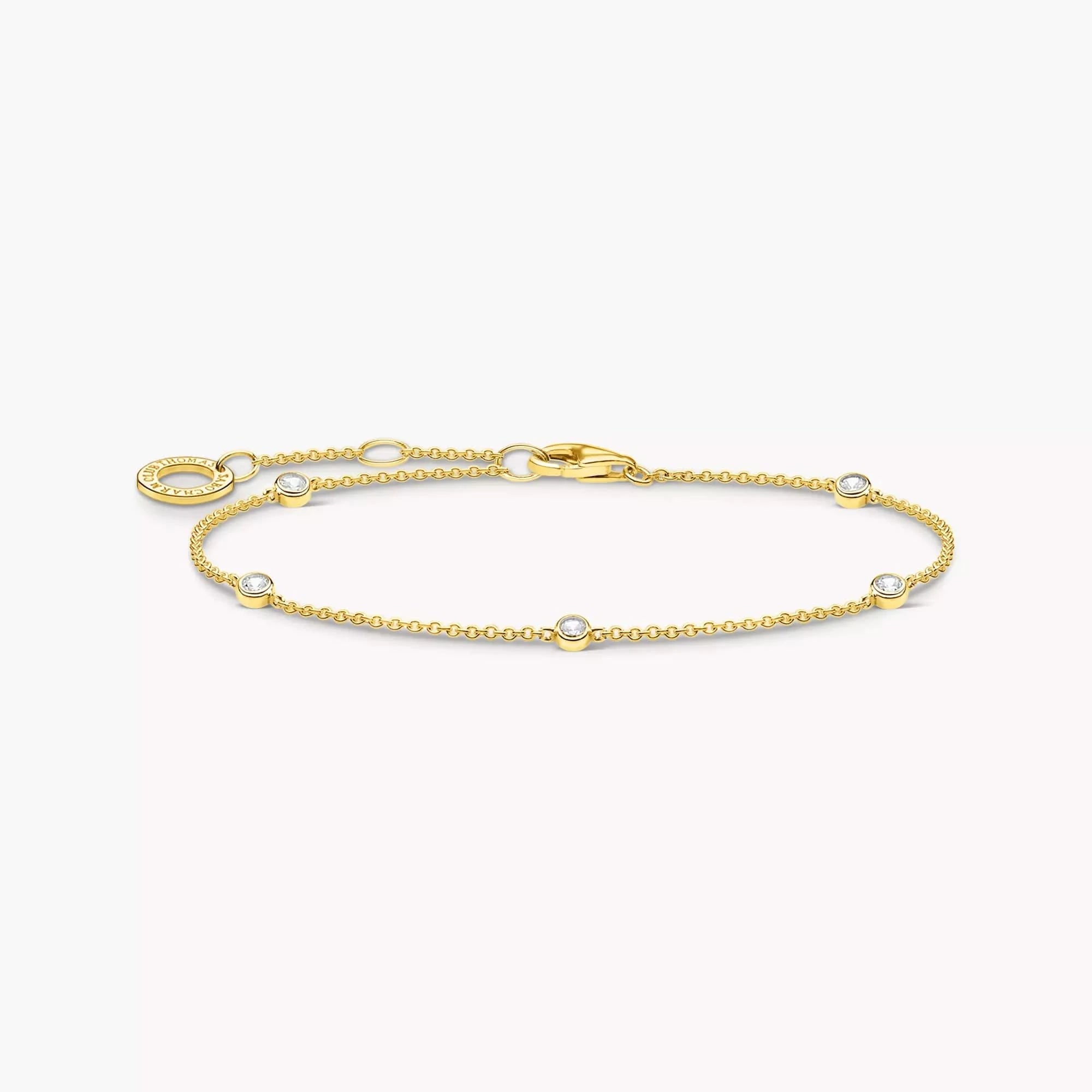 Goldfarbenes Armband mit weißen Steinen und ovalen Gliedern