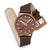Mondaine Unisex-Uhr mit braunem Lederband; braunes Zifferblatt, rote Akzente, verstellbare Schlaufe.