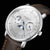 Sternglas Herrenuhr Nahansicht: silberfarbenes Zifferblatt mit blauer Mondphase, braunes Lederband.