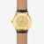 Sternglas Herrenuhr mit schwarzem Lederband, goldfarbene Rückseite mit Gravur