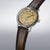 SEIKO Presage Herrenuhr schräg: gelbes Zifferblatt, braunes Lederband, mit Krone