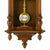 Mechanische Wanduhr aus Nussbaumholz mit goldenem Pendel und runder Pendelanzeige