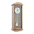 Wanduhr mit eichelfarbenem Holzgehäuse, blau-grauem Zifferblatt und Pendelmotiv