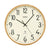 Wanduhr mit beigem Ziffernblatt, schwarzen Zahlen und Zeigern sowie hellem Holzrahmen.