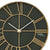 Detail der Wanduhr: dunkles Zifferblatt, goldfarbene Laserlinien, Zeiger und AMS-Logo